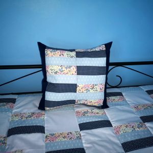blue patterned flower cushion