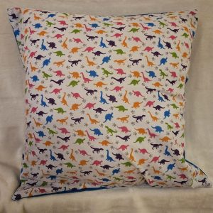 small dinosaurs cushion